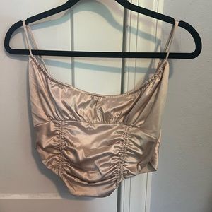 Champagne colored crop top. Super cute dressed up or down!